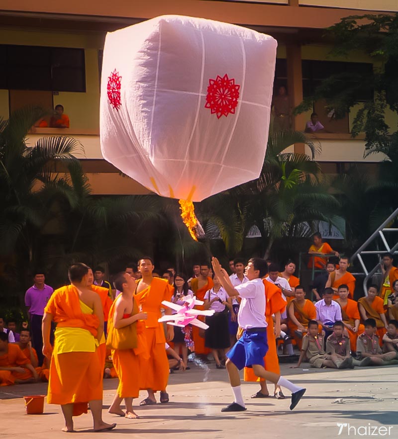 releasing khom fai lanterns in the daytime
