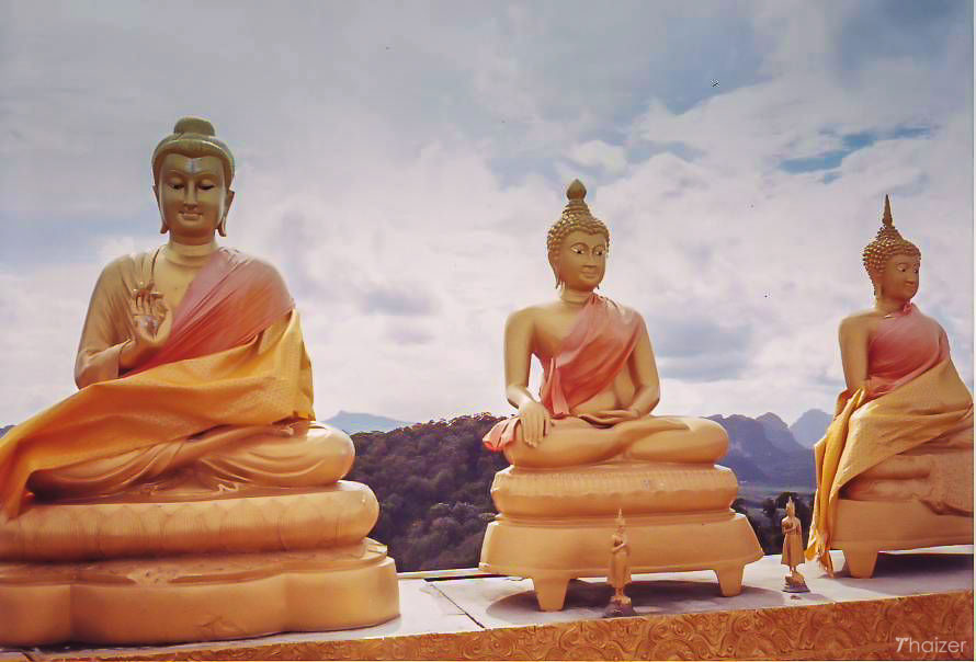 Buddha images high on the mountain at Wat Tham Seua, Krabi