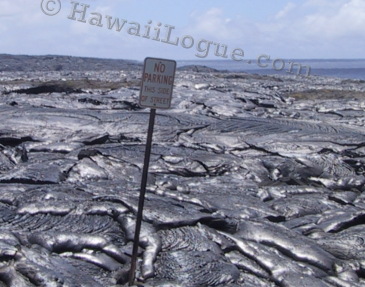 No Parking on this side of the street sign, surounded by lava