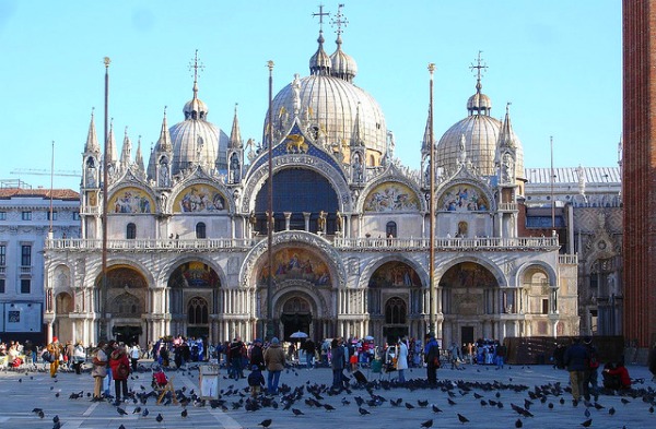 St. Mark's Square was long a gathering place for enormous numbers of pigeons, along with vendors selling pigeon food to tourists. More recently, the city has been trying to keep pigeon numbers down in the square, because of the damage the birds do to the historic buildings.