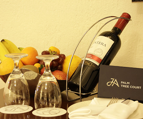 JA Palm Treet Court wine and fruit