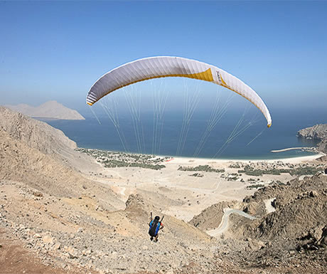 Paragliding into Zighy Bay