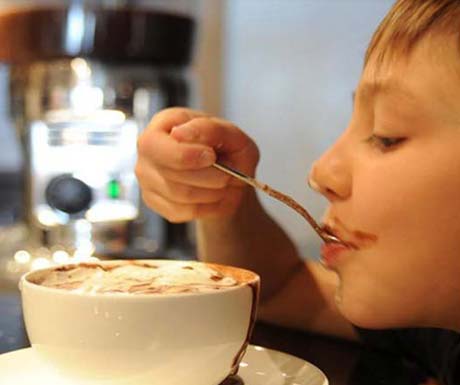 Child drinking hot chocolate