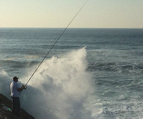 Fisherman on Estoril coastline