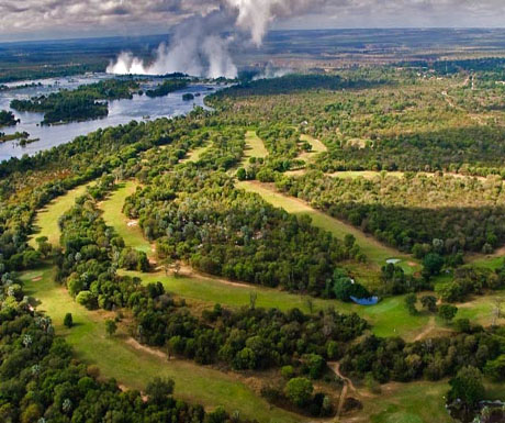 Golf greens with the mighty Victoria Falls in the backdrop  golf safaris in Africa offer adventure and leisure, all on African soil