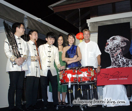 Members of a Chinese orchestra on stage with J-C Nager, General Manager of the Pavilions Phuket