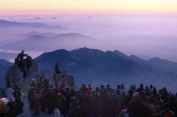 Crowds gather to see the sunrise from China's famed Mt. Tai.