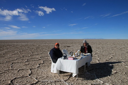 Eating in style: Lunch is served on a linen-covered table set up on the salt pan.