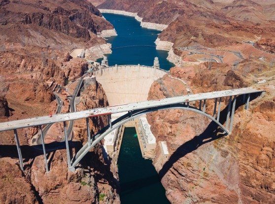 Hoover Dam: To fly over the Hoover Dam is to understand in one dizzying snapshot the power humans have to alter their ...