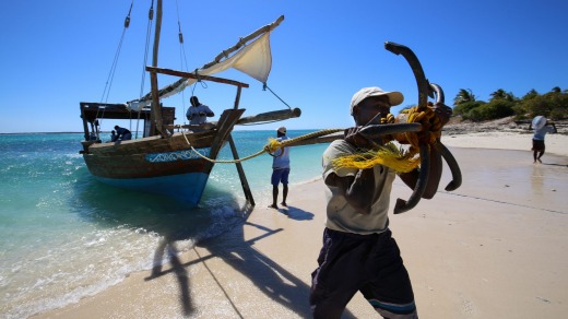 The dhow anchors on Mogundula Island's beach, in the Quirimbas Archipelago, Mozambique.