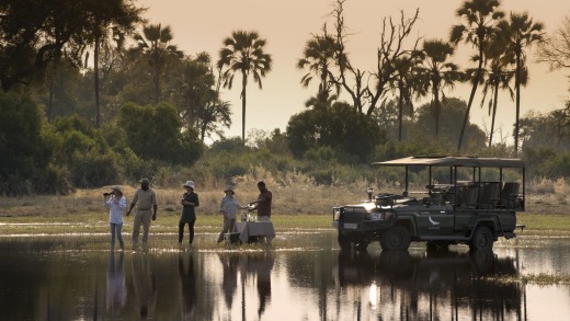 Tourists on a tour from Sandibe Lodge take refreshments.