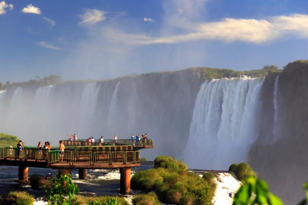 TAKE IT BY THE THROAT: One of the world's biggest falls - actually there's 275 of them - the mighty Iguazu​ Falls lies ...