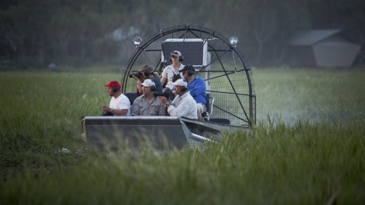 An airboat traverses a floodplain at Bamurru Plains safari camp.