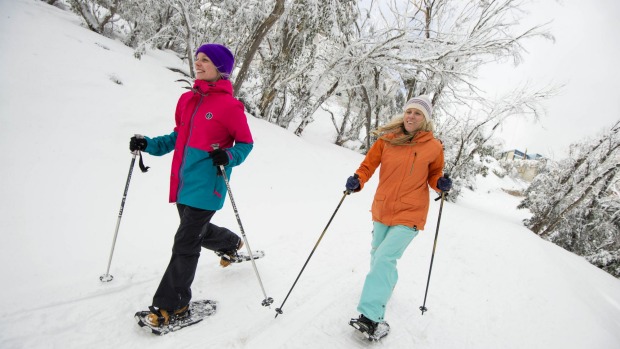 Mt Buller residents Gillian Dobson and Niki Donaldson enjoy a fresh and scenic snowshoe walk around the village. Photo:  ...