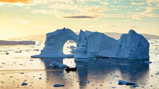 Icebergs in midnight sun, in Disko Bay, Greenland, on the Ilulissat Icefjord.