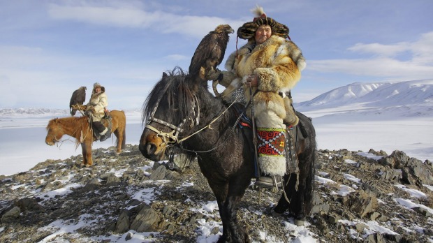 Epic Kazakh Golden Eagle hunters on horseback.