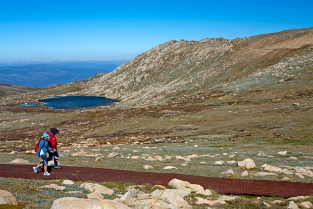 Mt Kosciuszko, NSW: Hikers pass Lake Cootapatamba on the walk to Mt Kosciuszko.