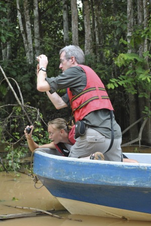 Tourists on a tributary of the Kinabatangan River, Sabah, Malaysia.