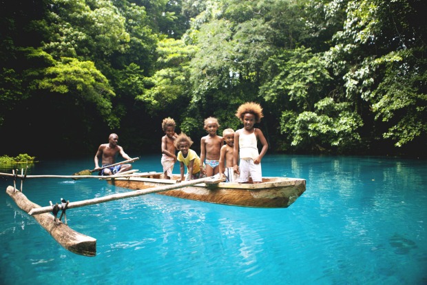 Children on a blue hole in Espiritu Santo.