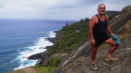 Seventh generation mutineer descendant Kerry Young climbs the cliffs to Christian's Cave.