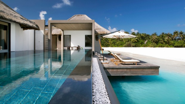 Private pleasures: Garden villas are perched right over the lagoon and feature a private backyard garden.