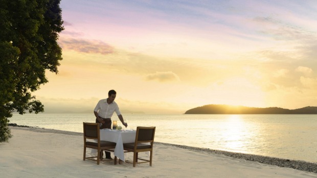 Dinner on Pebble Beach at sunset at qualia Resort, Hamilton Island.