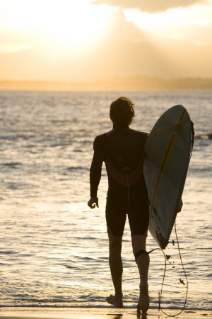 Heading out for a sunset surf at The Pass, Byron Bay.