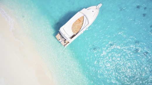 A boat anchored in a tropical lagoon.