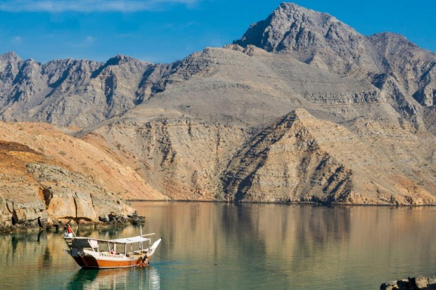 Cruise in the fjords on a dhow, traditional wooden ship in Oman.