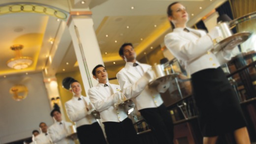 At 3.30pm on the dot, a bevy of white-gloved and white-jacketed waiters arrive to present the high tea.