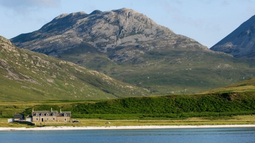 The white sandy shore of Loch Tarbert on the west side of Jura.