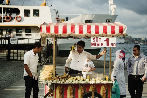 Street Vendor selling roasted corn along the Bosphorus river in Istanbul, Turkey, Europe.