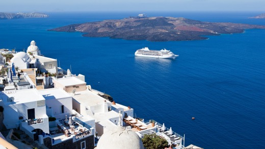 Regent Seven Seas Mariner off the Greek island of Santorini.