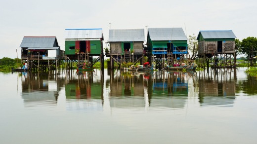 Charming coloured huts on stilts make up this picturesque floating village on Tonle Sap Lake.