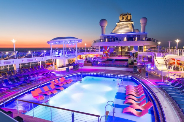 Anthem of the Seas' pool deck at sunset.