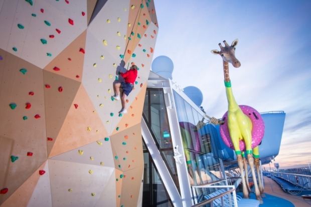 Gigi the Giraffe and the climbing wall on board Anthem of the Seas