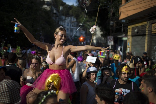 A reveller enjoys the "Ceu na Terra", or Heaven on earth, block party during Carnival celebrations in Rio de Janeiro, Brazil.