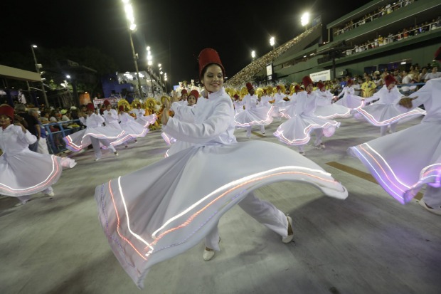Performers from the Estacio de Sa samba school parade during Carnival celebrations at the Sambadrome in Rio de Janeiro, ...
