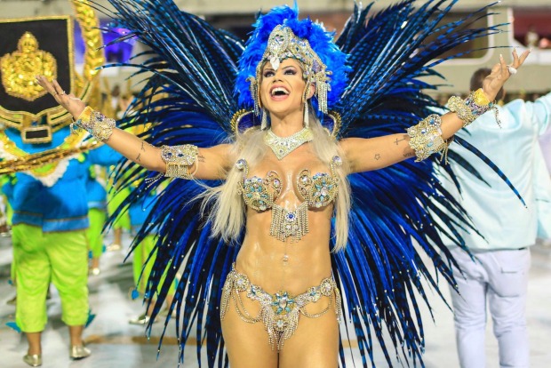 Members of the Academic Rocinha samba school perform during the first day of parades serial access group at Marques de ...