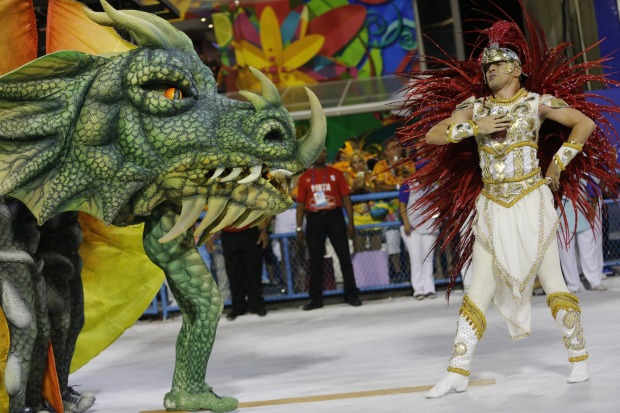 Performers from the Estacio de Sa samba school parade during Carnival celebrations at the Sambadrome in Rio de Janeiro, ...
