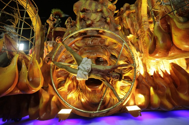 Performers from the Estacio de Sa samba school parade during Carnival celebrations at the Sambadrome in Rio de Janeiro, ...