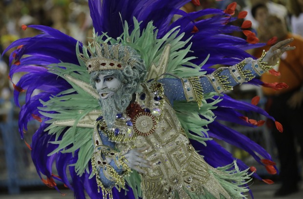 A performer from Uniao da Ilha samba school parades during Carnival celebrations at the Sambadrome in Rio de Janeiro, Brazil.