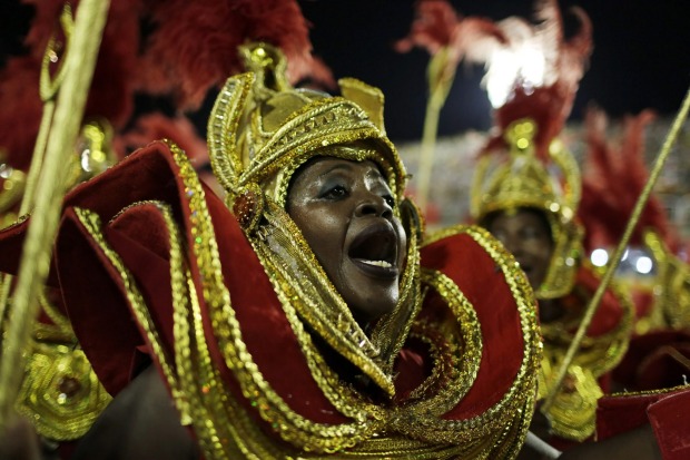A performer from Estacio de Sa samba school parades during the Carnival celebrations at the Sambadrome in Rio de ...