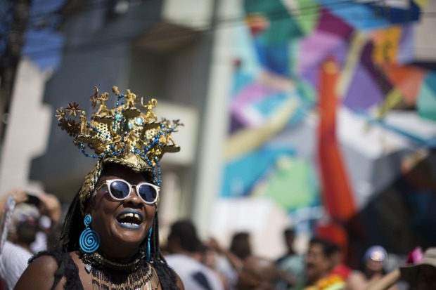 A reveller enjoys the "Carmelitas" block party during Carnival celebrations in Rio de Janeiro, Brazil.