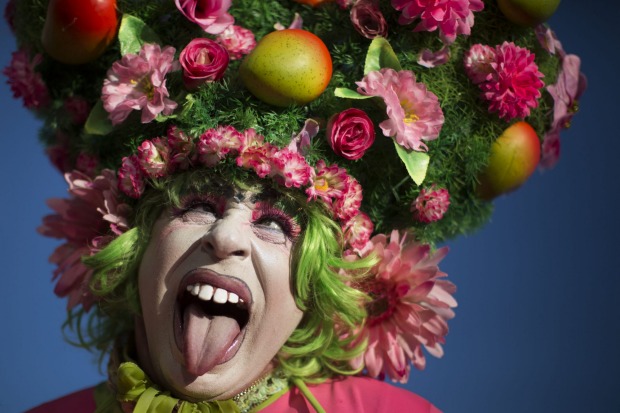 A reveller strikes a pose during the Banda de Ipanema carnival block party in Rio de Janeiro, Brazil. Rio's over-the-top ...