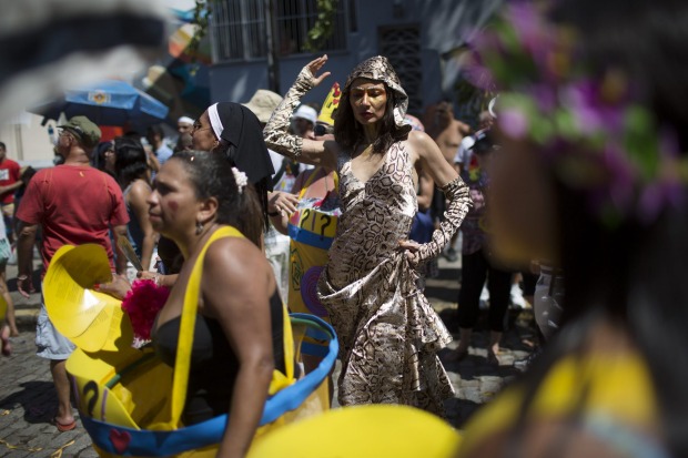 A reveller performs at the "Carmelitas: block party during Carnival celebrations in Rio de Janeiro, Brazil.