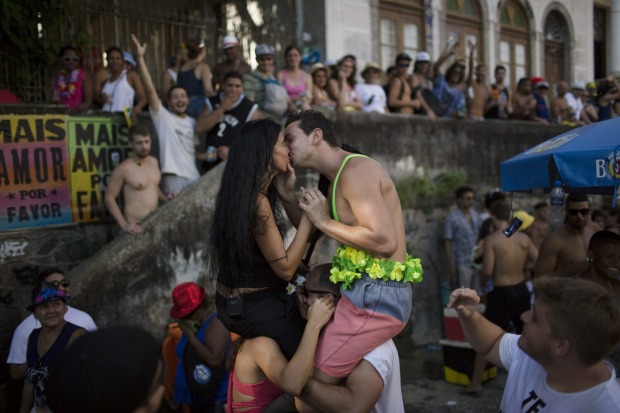 A couple kisses during the "Carmelitas" block party, during Carnival celebrations in Rio de Janeiro, Brazil.