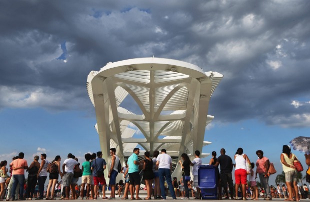 People gather at the opening day of the Museum of Tomorrow, designed by Spanich architect Santiago Calatrava, in the ...