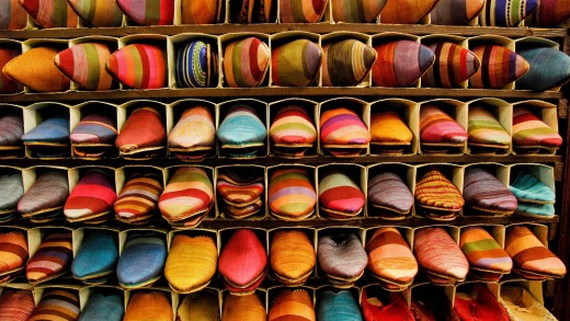 Brightly coloured Moroccan slippers (babouches) in souk, Marrakesh.
