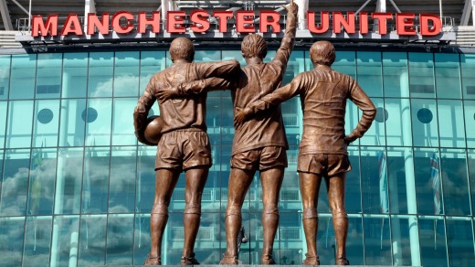 Bronze statues of Manchester United Legends Sir Bobby Charlton, Denis Law and George Best at Old Trafford.